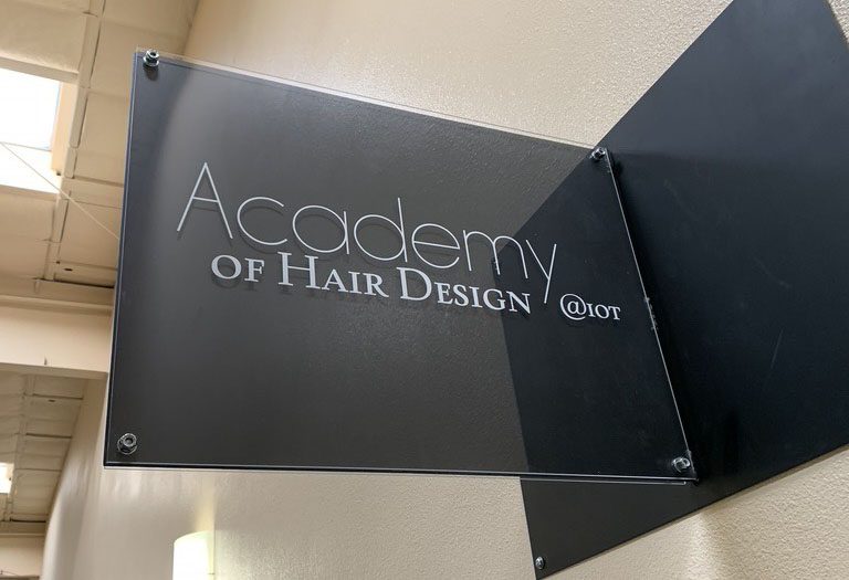 Academy of Hair design sign
