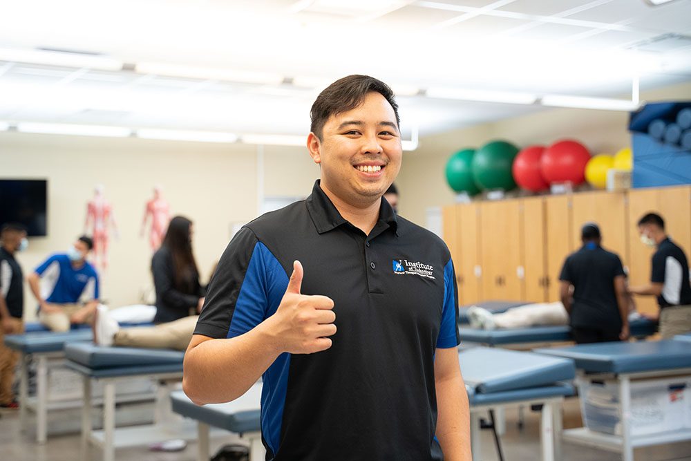 Physical therapy student giving thumbs up