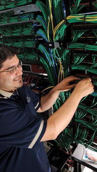Man in front of wiring